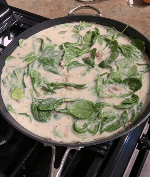 A pan of food on top of the stove.