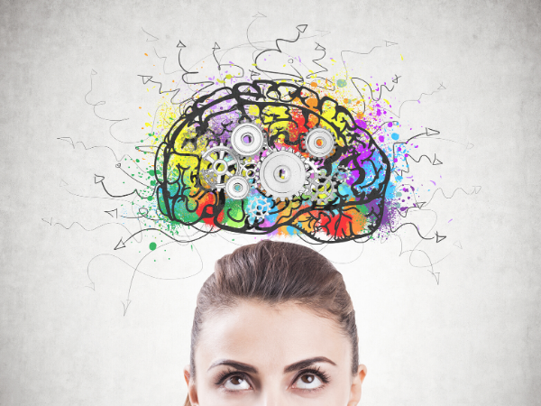 woman's face with cartoon depiction of an overloaded brain