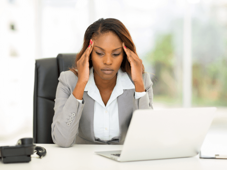 Stressed woman at a desk