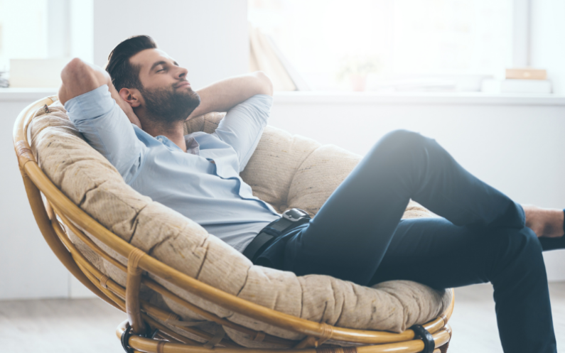 relaxed man reclining in chair