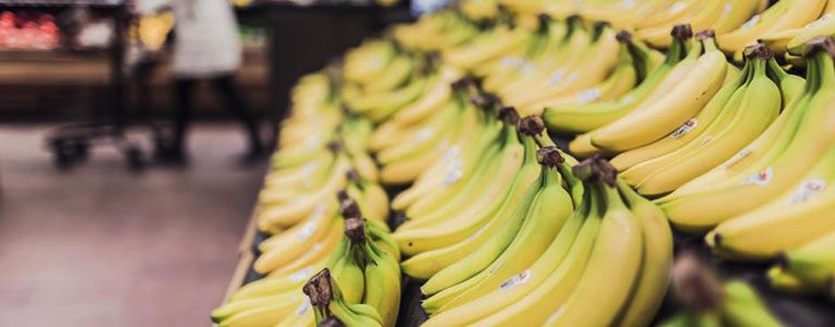 A bunch of bananas are on display in the store.