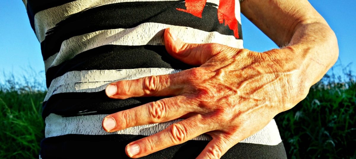 A close up of the hands of an older person