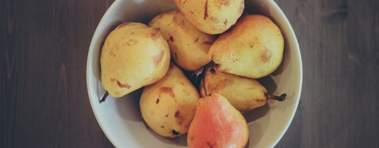 A bowl of pears and a pear in it.