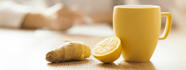 A cup of tea and lemon on the table